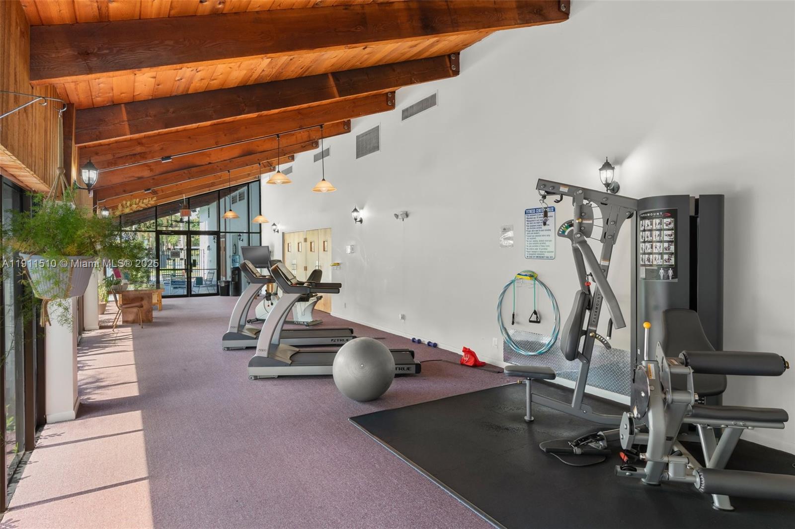 7640 Northwest 18th Street, Unit 301 Margate, FL 33063 - Photo 28 of 35 a view of a room with gym equipment