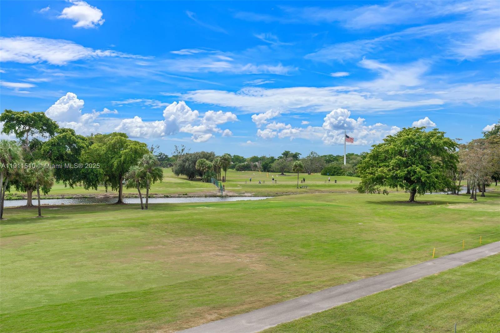 7640 Northwest 18th Street, Unit 301 Margate, FL 33063 - Photo 3 of 35 a view of a big yard with a house in the background