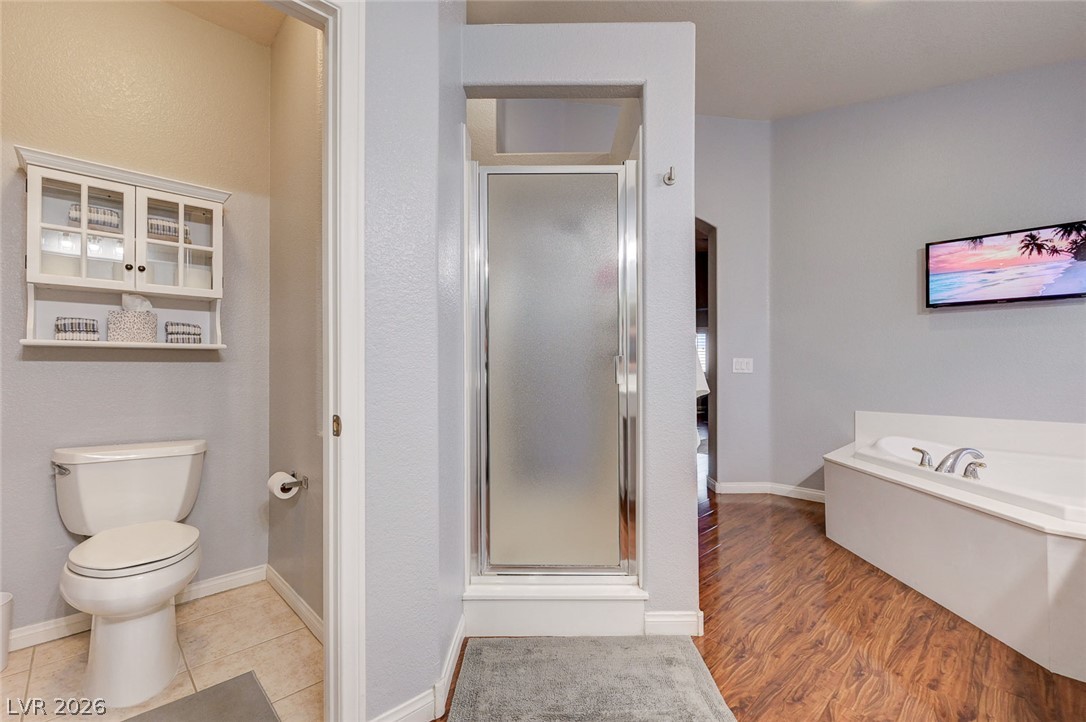 1604 Cattle Ranch Place Henderson, NV 89002 - Photo 44 of 99 Indulge in a private oasis with a soaking tub and separate shower stall.