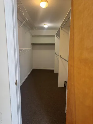 a view of storage and utility room with a fireplace