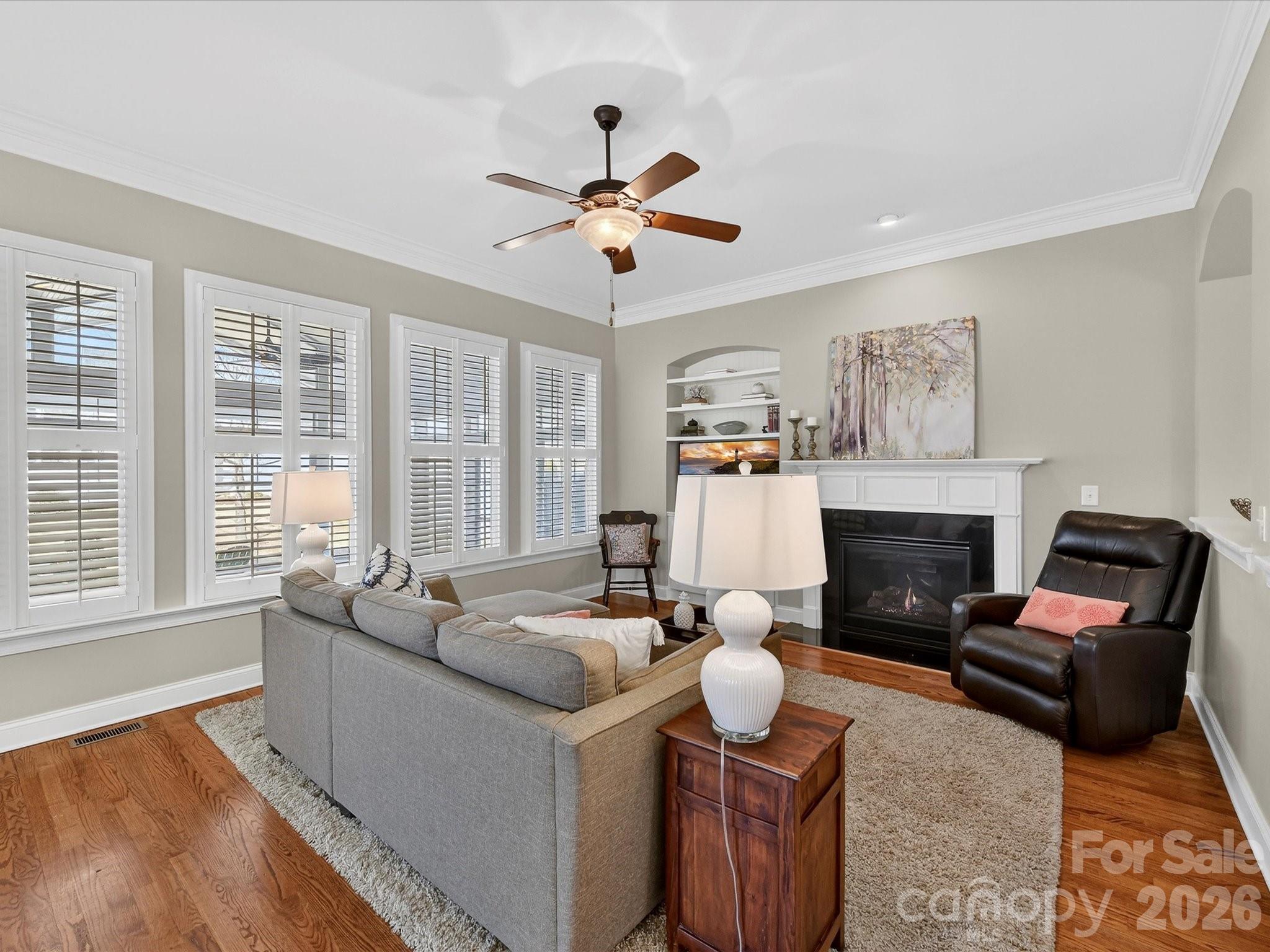 4265 Birkshire Heights Fort Mill, SC 29708 - Photo 11 of 47 a living room with furniture fireplace and a large window
