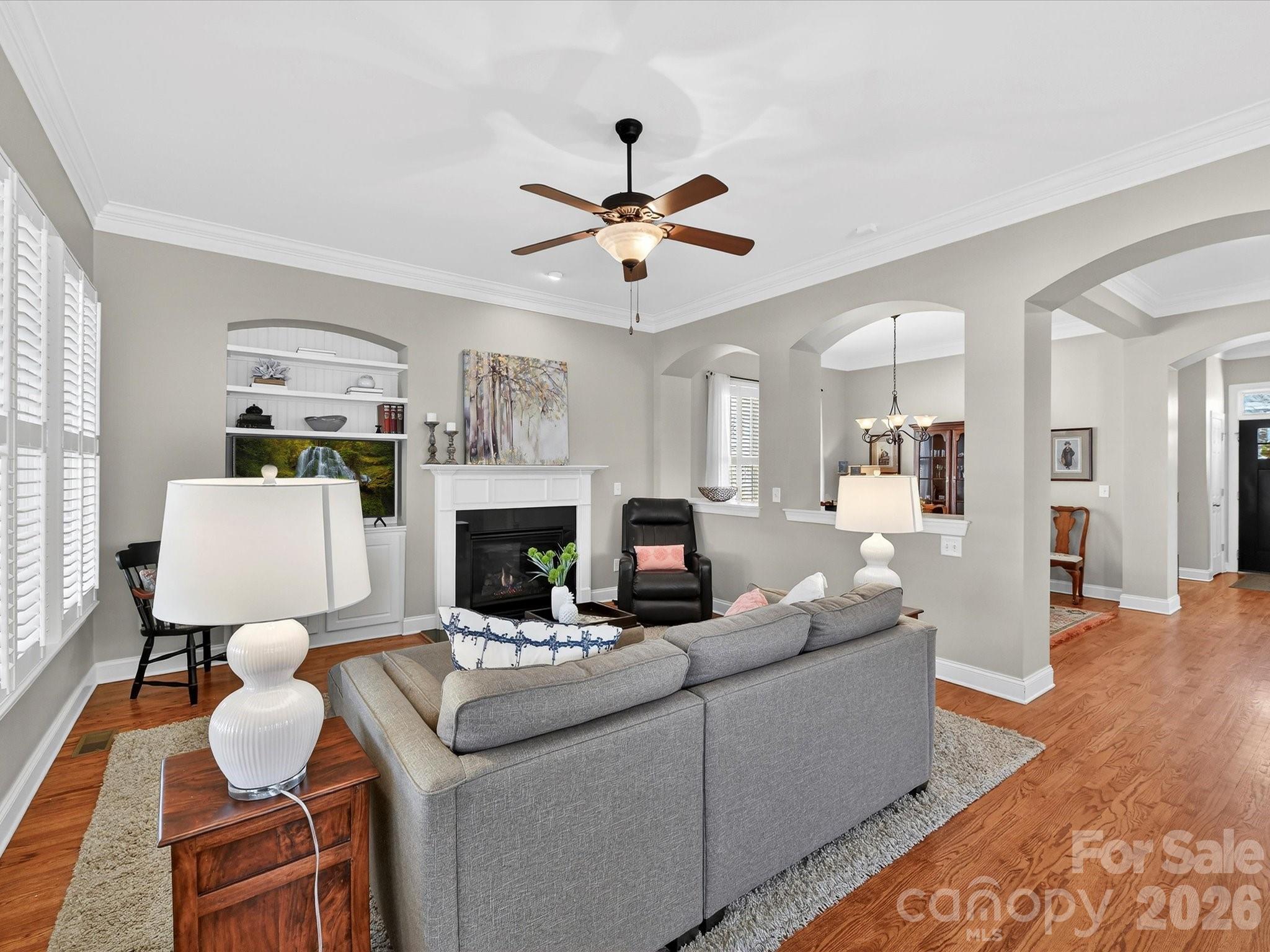 4265 Birkshire Heights Fort Mill, SC 29708 - Photo 12 of 47 a living room with furniture and a fireplace
