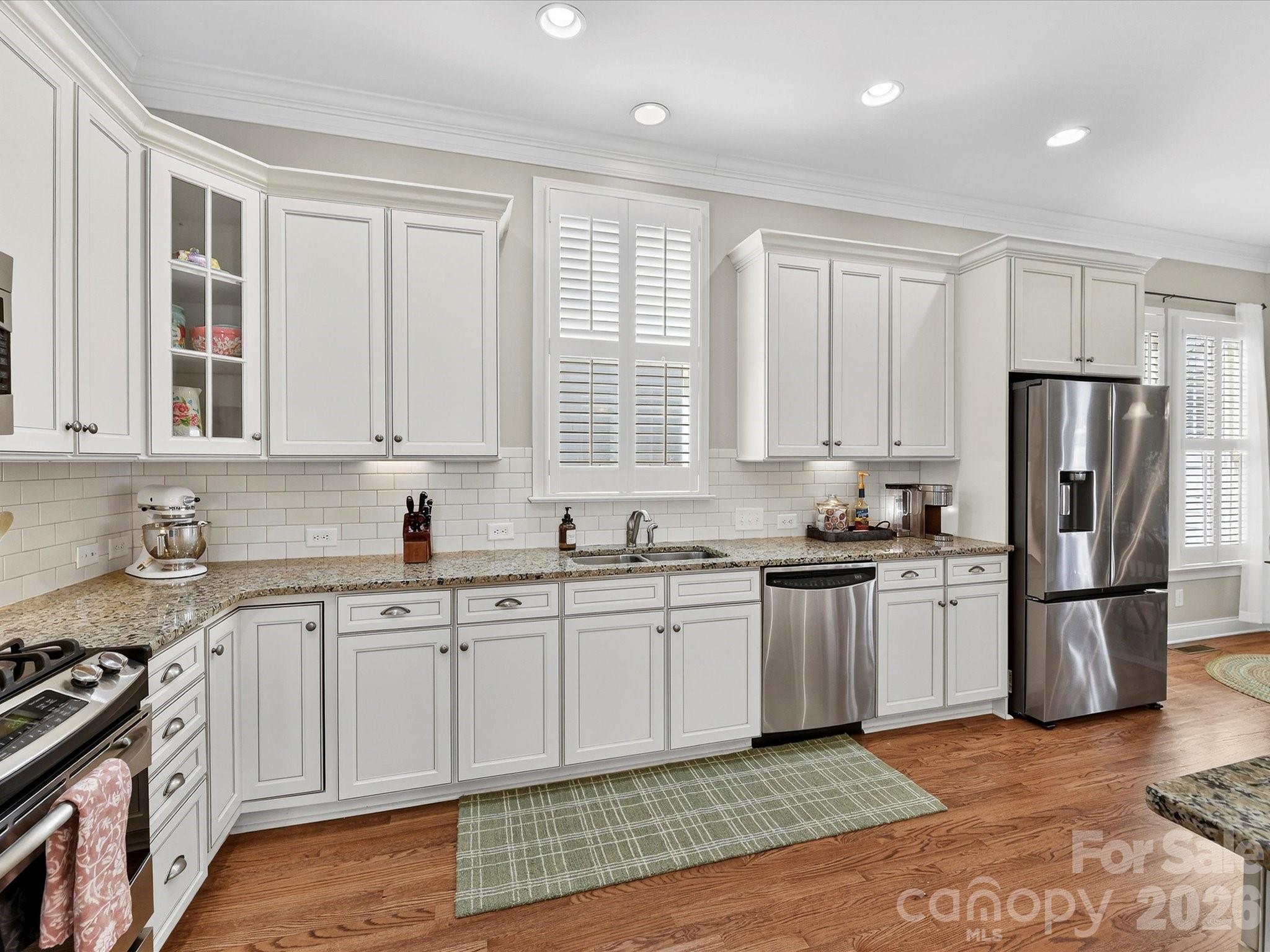 4265 Birkshire Heights Fort Mill, SC 29708 - Photo 17 of 47 a kitchen with a sink stove and refrigerator