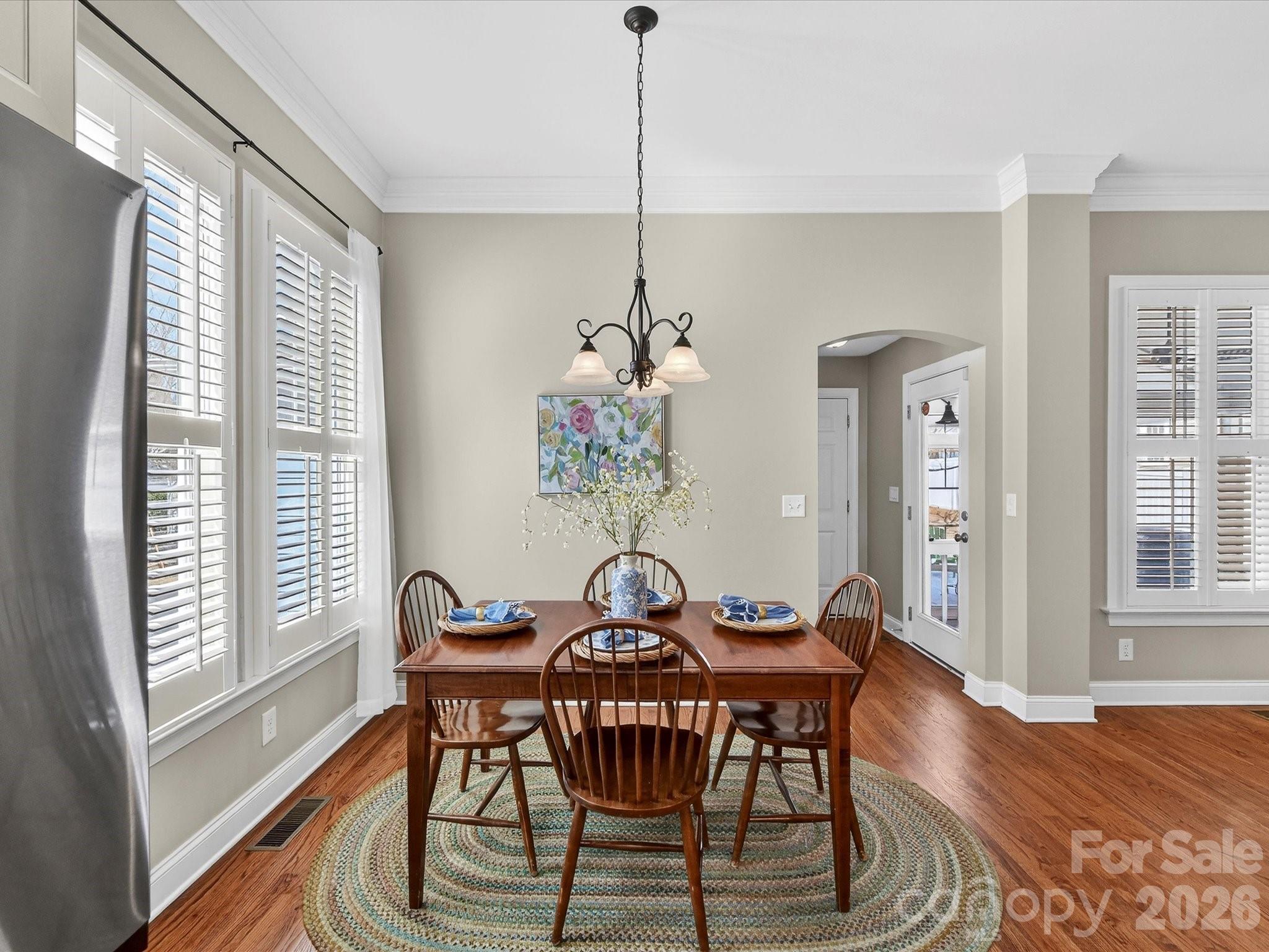 4265 Birkshire Heights Fort Mill, SC 29708 - Photo 19 of 47 a view of a dining room with furniture window and wooden floor