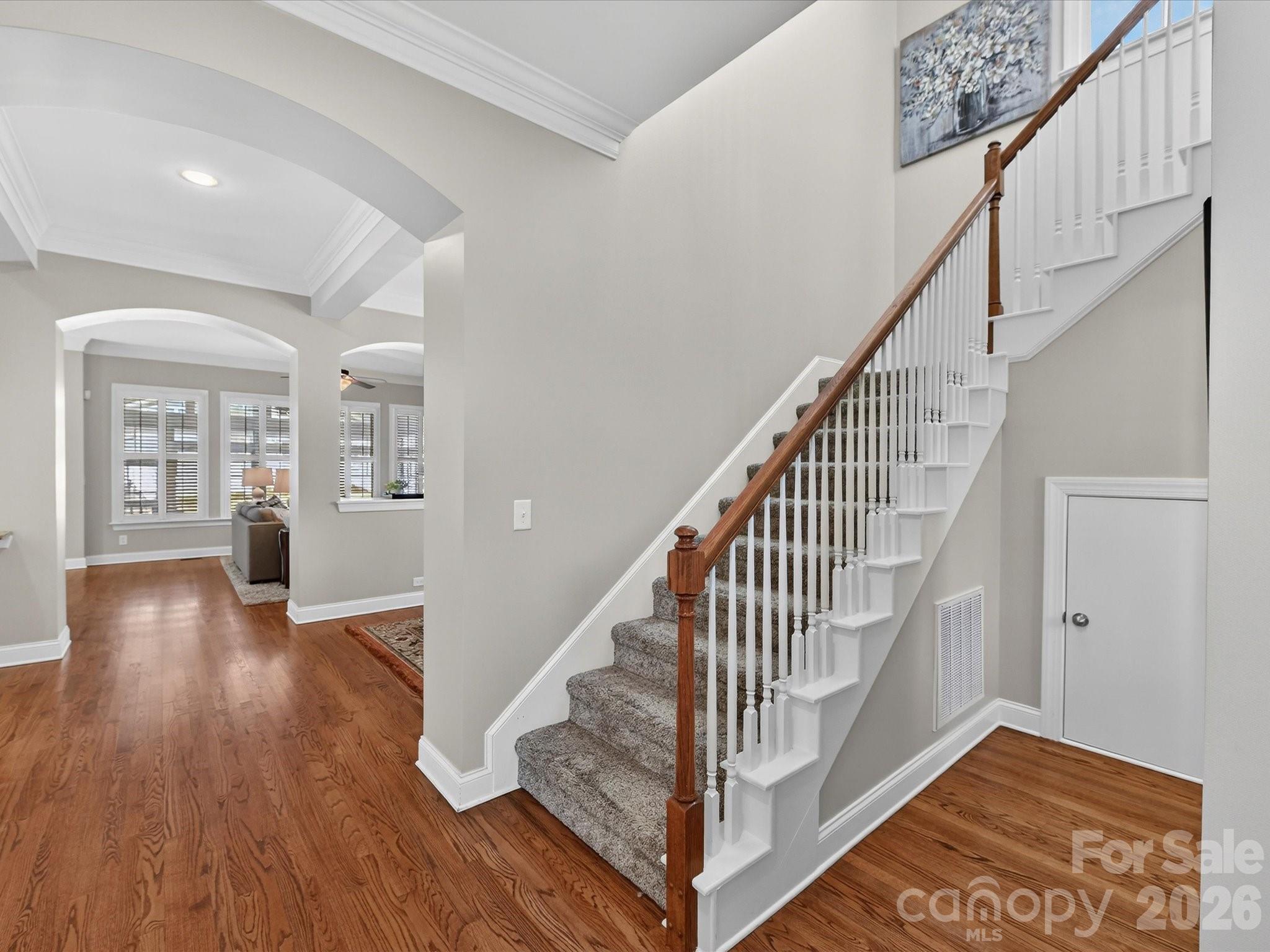 4265 Birkshire Heights Fort Mill, SC 29708 - Photo 21 of 47 a view of entryway with wooden floor and stairs