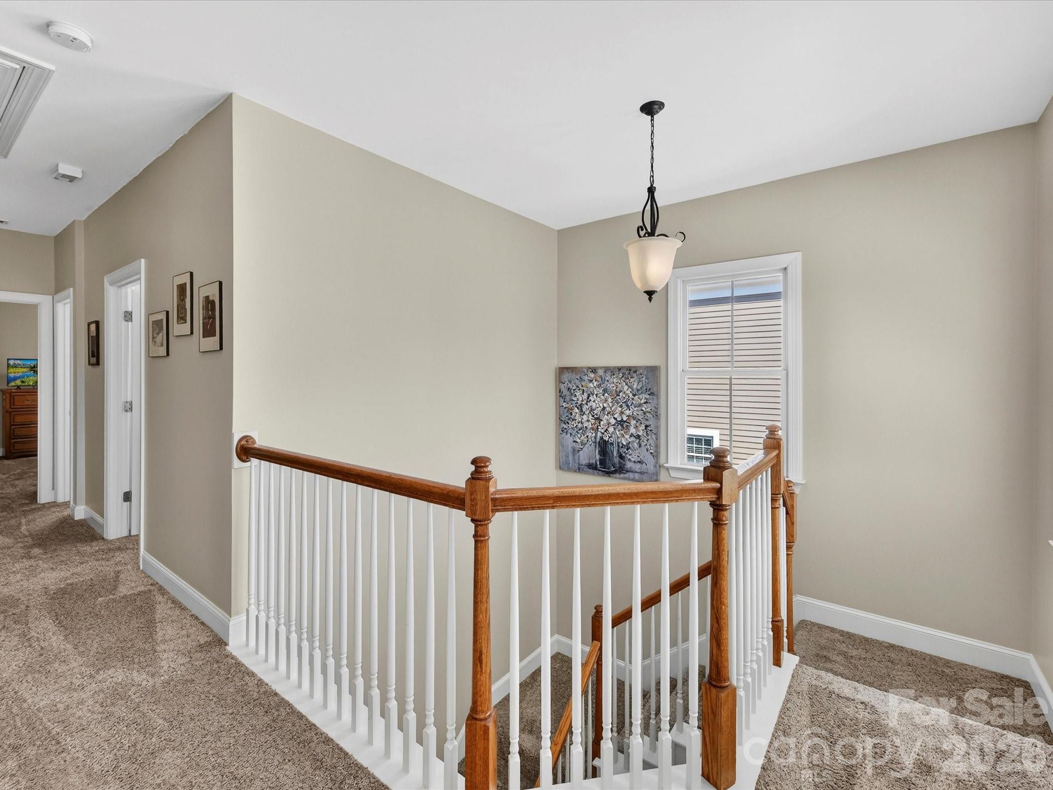 4265 Birkshire Heights Fort Mill, SC 29708 - Photo 22 of 47 a view of a hallway with window and stairs