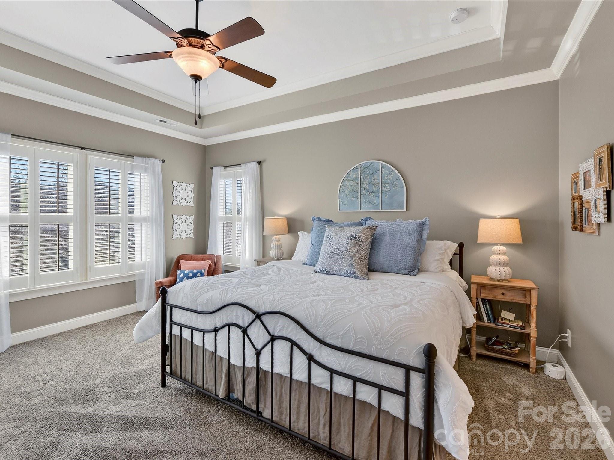 4265 Birkshire Heights Fort Mill, SC 29708 - Photo 26 of 47 a bedroom with a bed mirror and a window