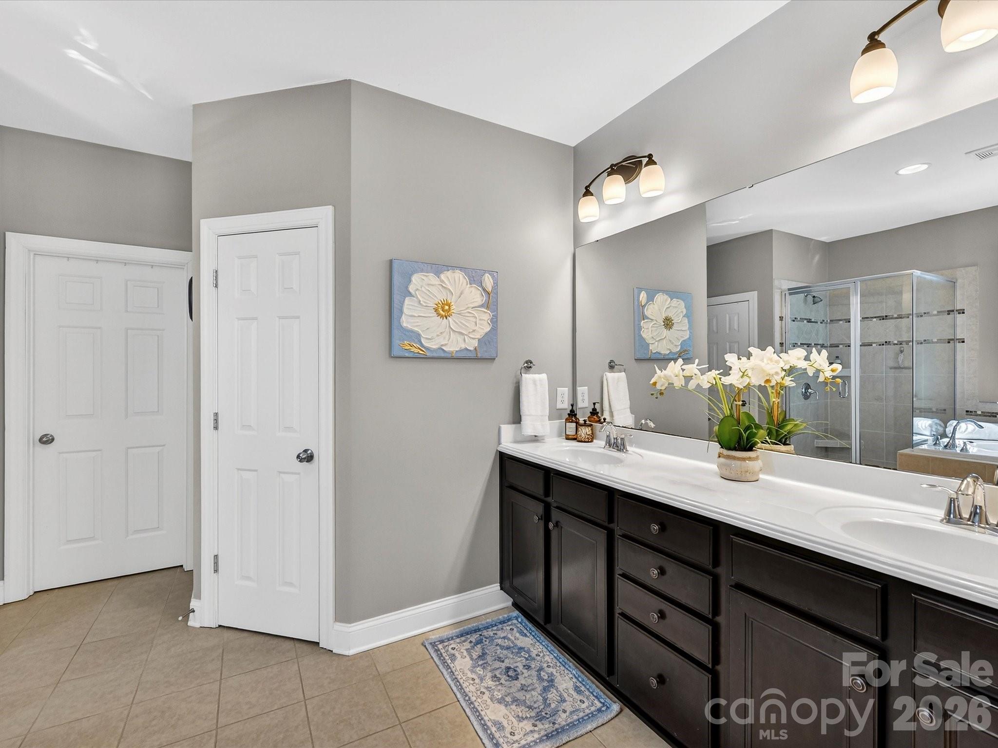4265 Birkshire Heights Fort Mill, SC 29708 - Photo 28 of 47 a bathroom with a double vanity sink and a mirror
