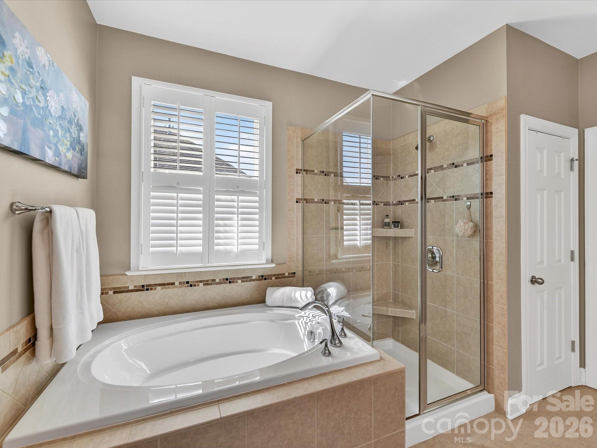 4265 Birkshire Heights Fort Mill, SC 29708 - Photo 29 of 47 a bathroom with a bathtub and a shower
