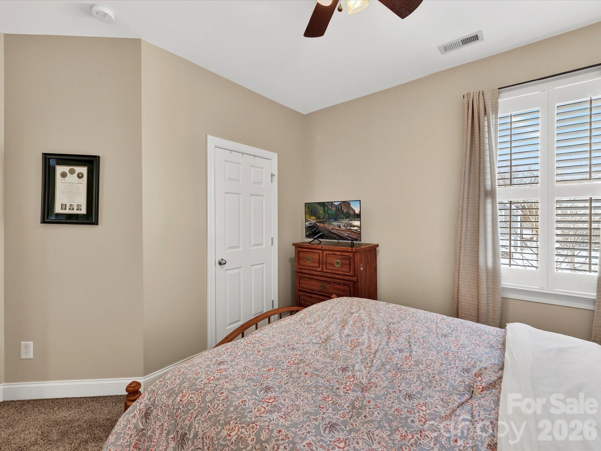 4265 Birkshire Heights Fort Mill, SC 29708 - Photo 32 of 47 a bedroom with a bed and a dresser
