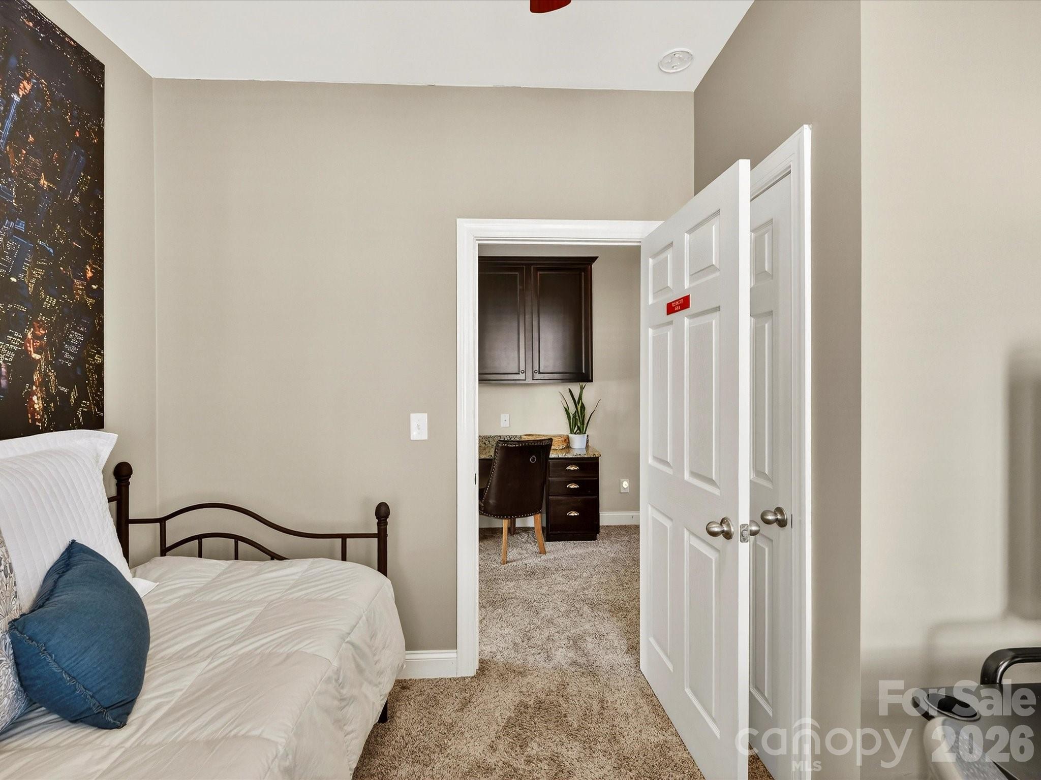 4265 Birkshire Heights Fort Mill, SC 29708 - Photo 37 of 47 a bedroom with a bed and a view of en suite bathroom