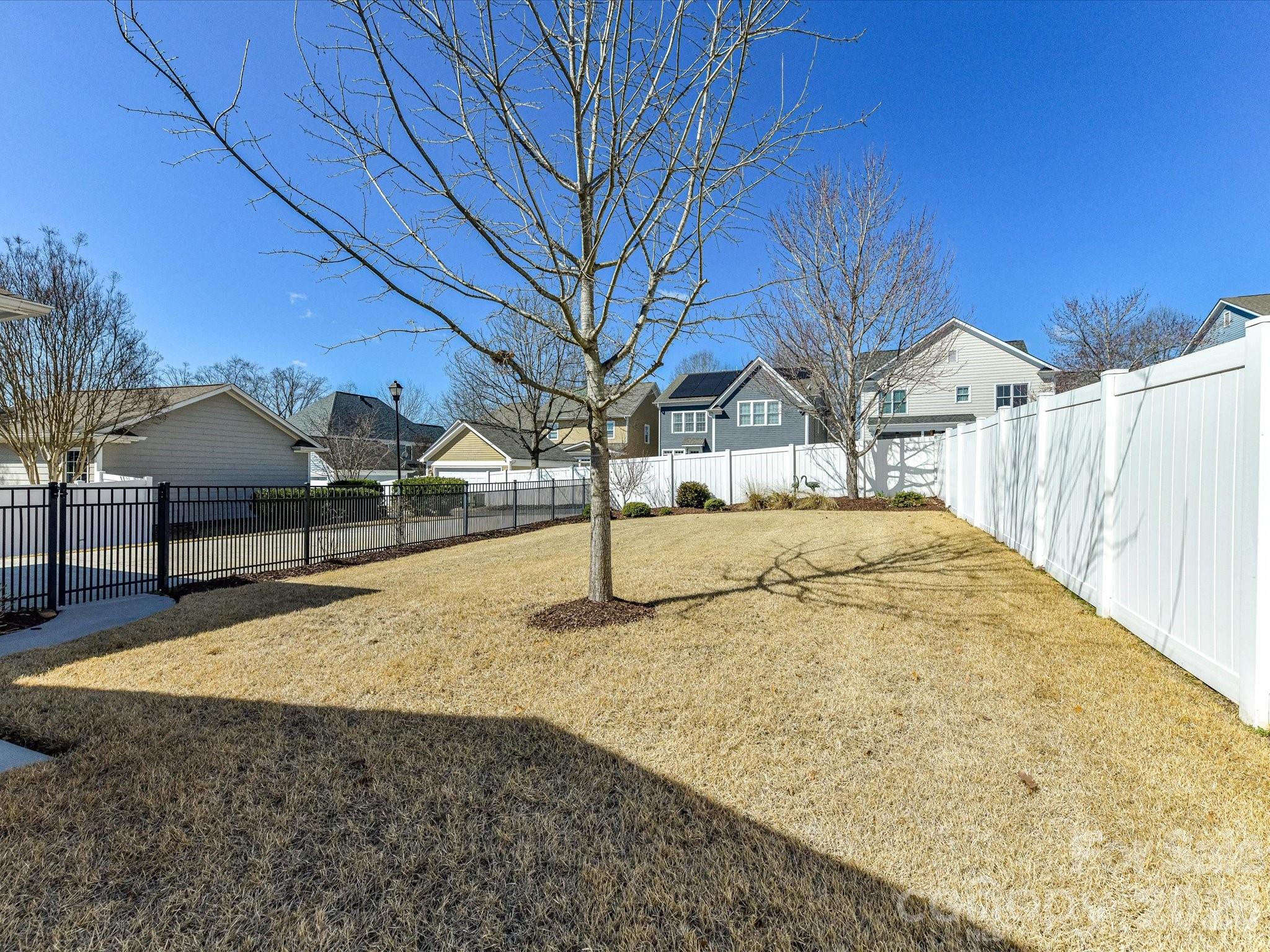 4265 Birkshire Heights Fort Mill, SC 29708 - Photo 42 of 47 a view of tall trees with wooden fence