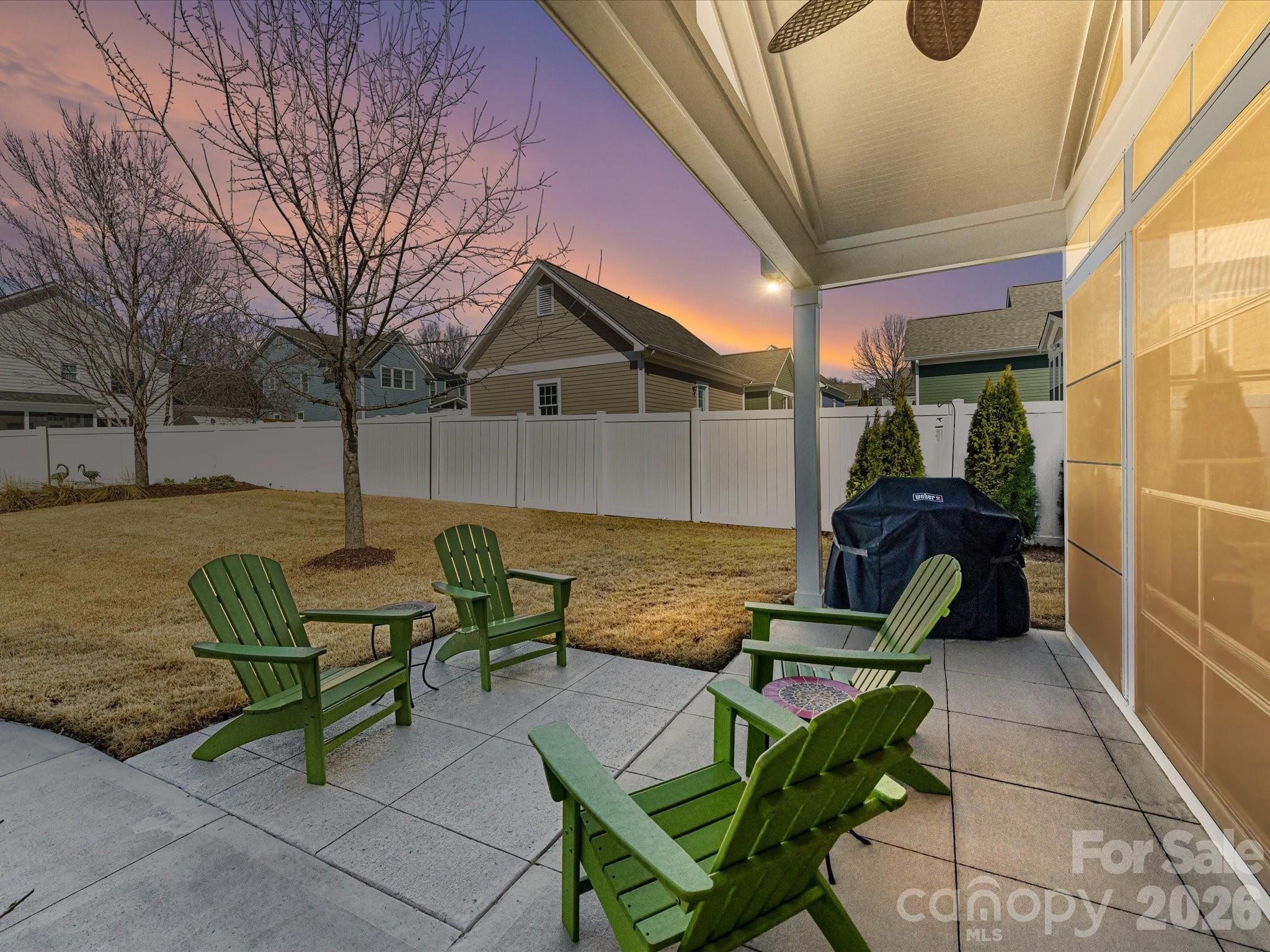 4265 Birkshire Heights Fort Mill, SC 29708 - Photo 46 of 47 a view of a terrace with chairs and a fire pit