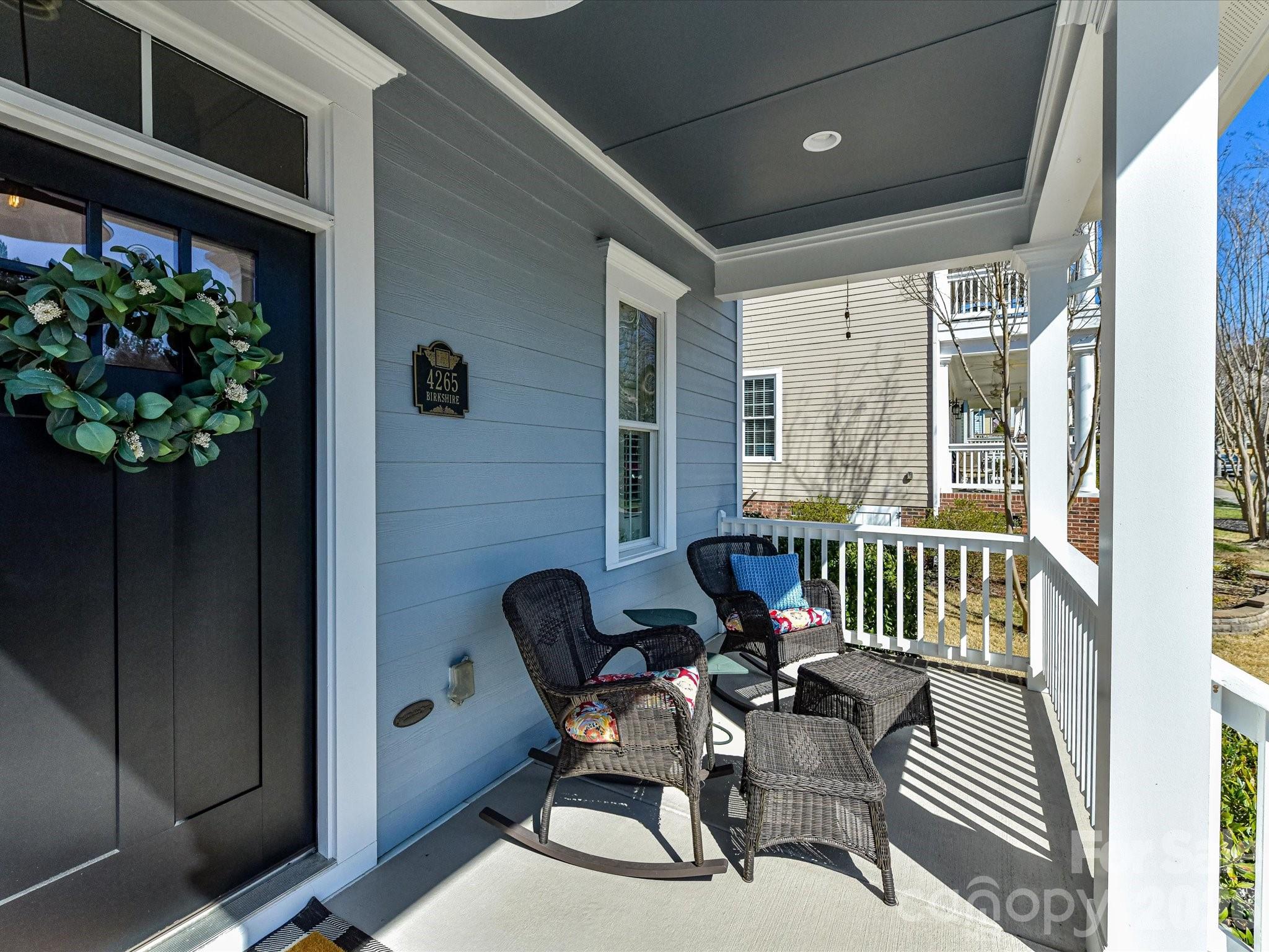 4265 Birkshire Heights Fort Mill, SC 29708 - Photo 5 of 47 a view of a balcony with chair and potted plant