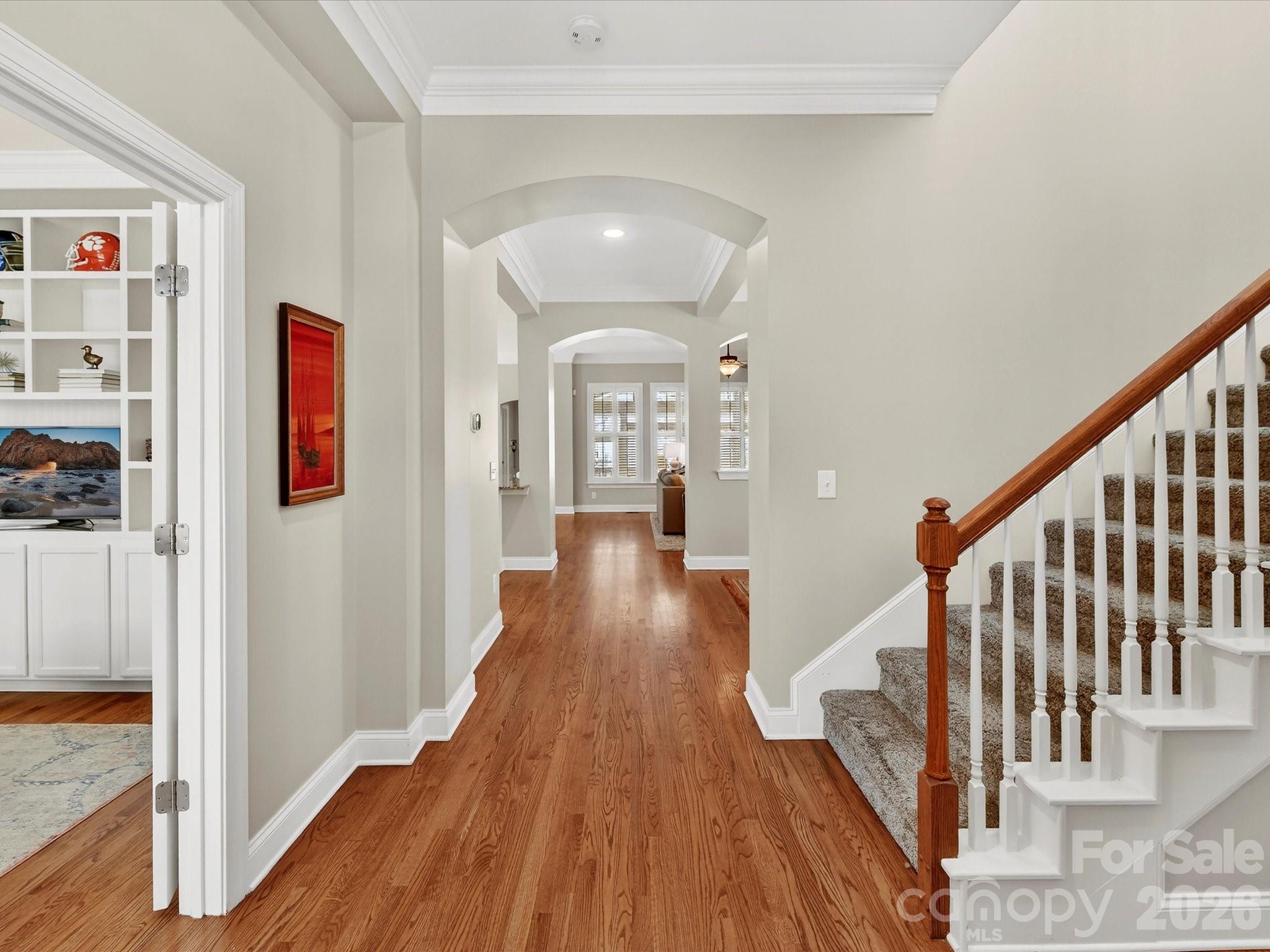 4265 Birkshire Heights Fort Mill, SC 29708 - Photo 6 of 47 a view of a hallway with wooden floor and staircase