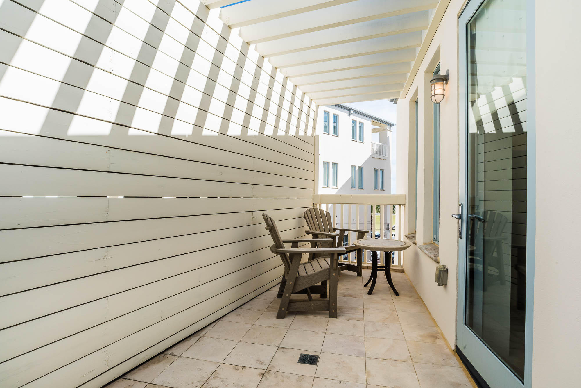 35 Central Square, Unit A2 Santa Rosa Beach, FL 32459 - Photo 22 of 34 a roof deck with a table and chairs
