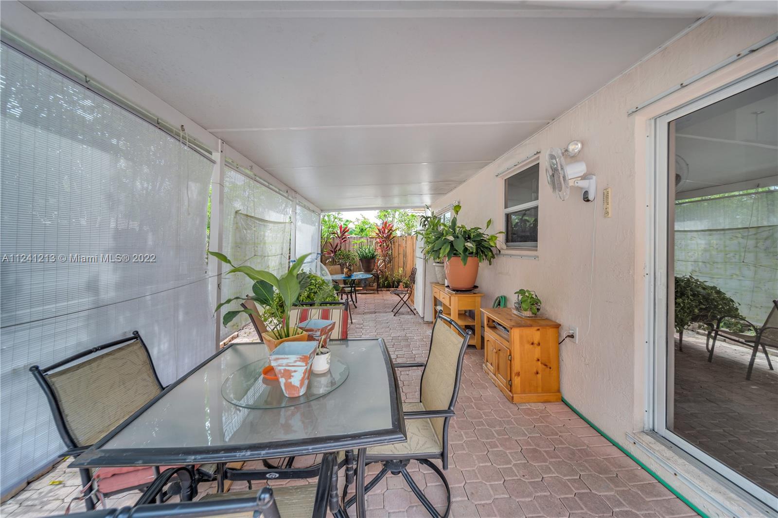 14202 Southwest 151st Court Miami, FL 33196 - Photo 20 of 23 a view of a dining room with furniture window and wooden floor