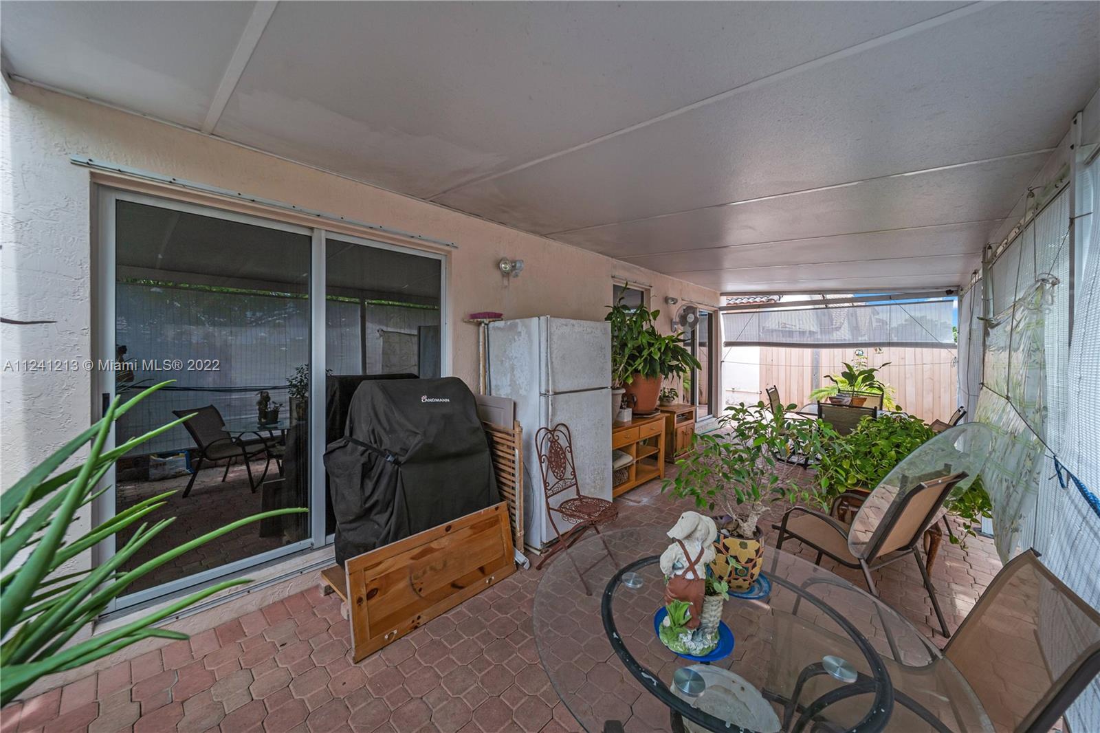14202 Southwest 151st Court Miami, FL 33196 - Photo 21 of 23 a living room filled with furniture