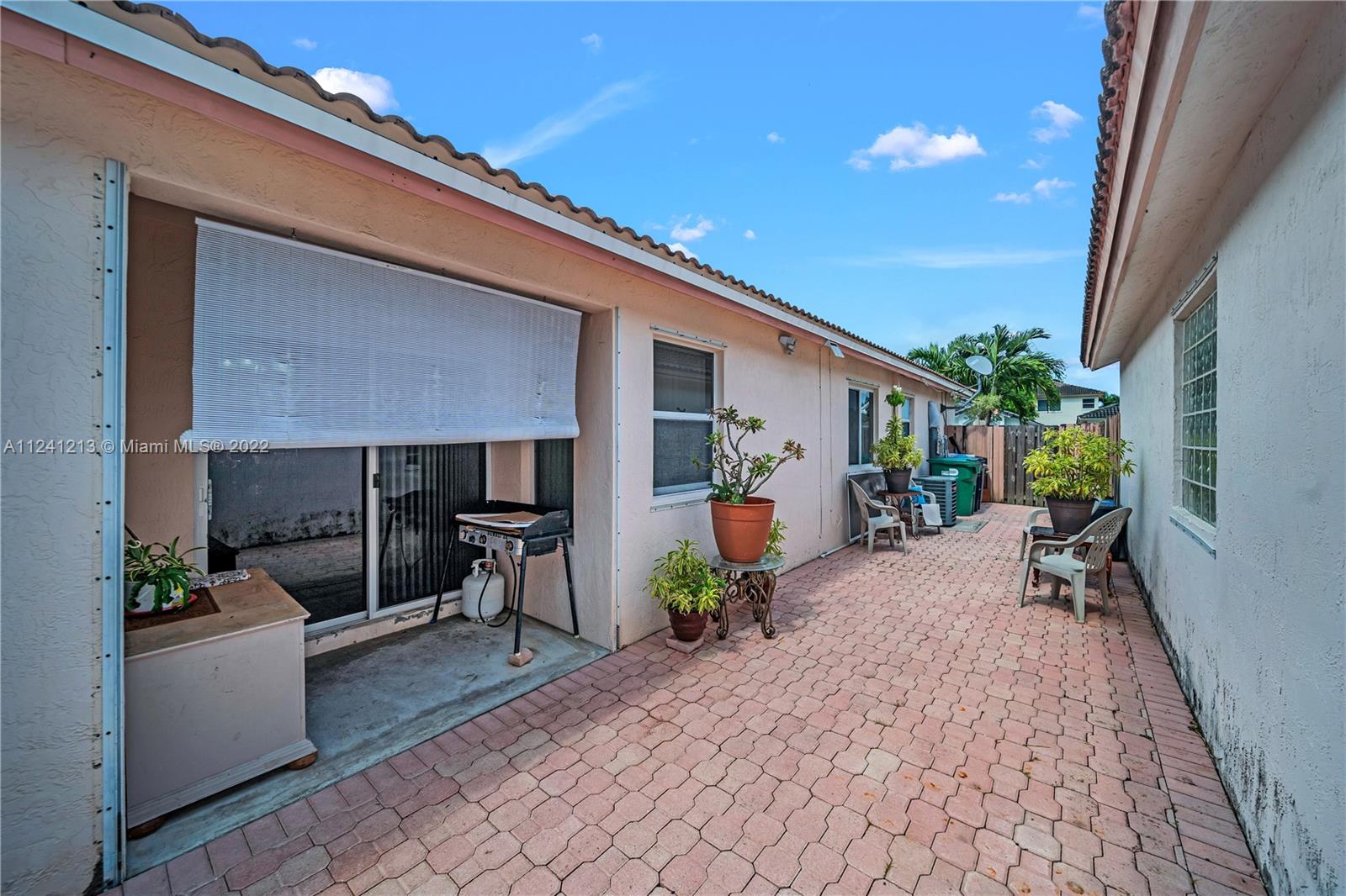 14202 Southwest 151st Court Miami, FL 33196 - Photo 22 of 23 a view of living room and patio