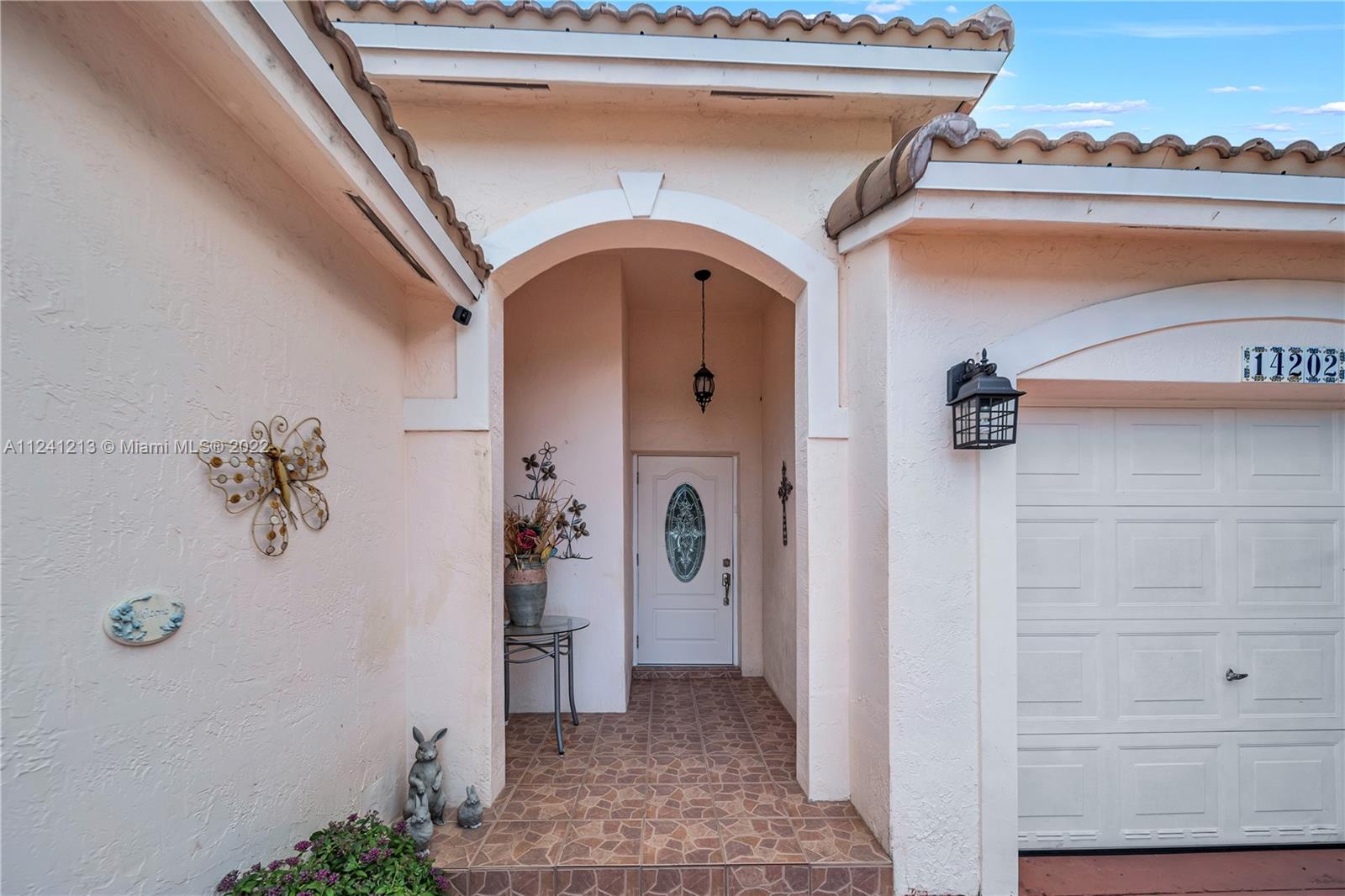 14202 Southwest 151st Court Miami, FL 33196 - Photo 3 of 23 a view of a hallway with entryway door