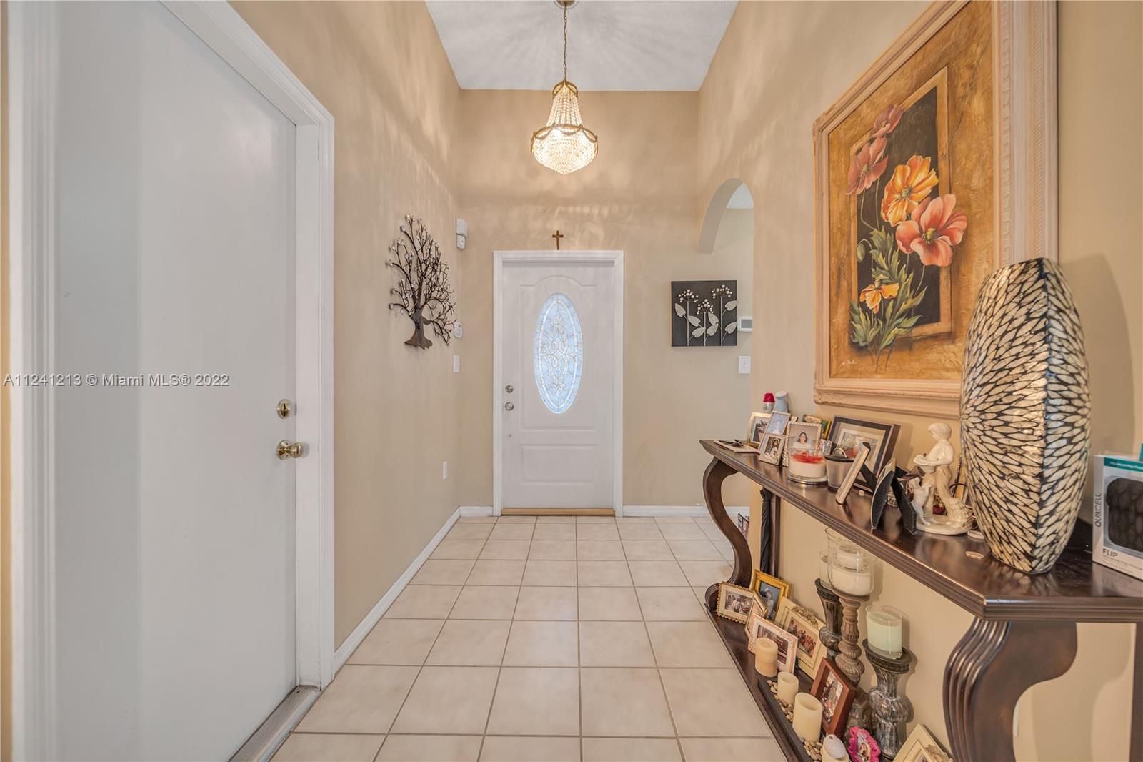 14202 Southwest 151st Court Miami, FL 33196 - Photo 4 of 23 a view of a hallway with seating area