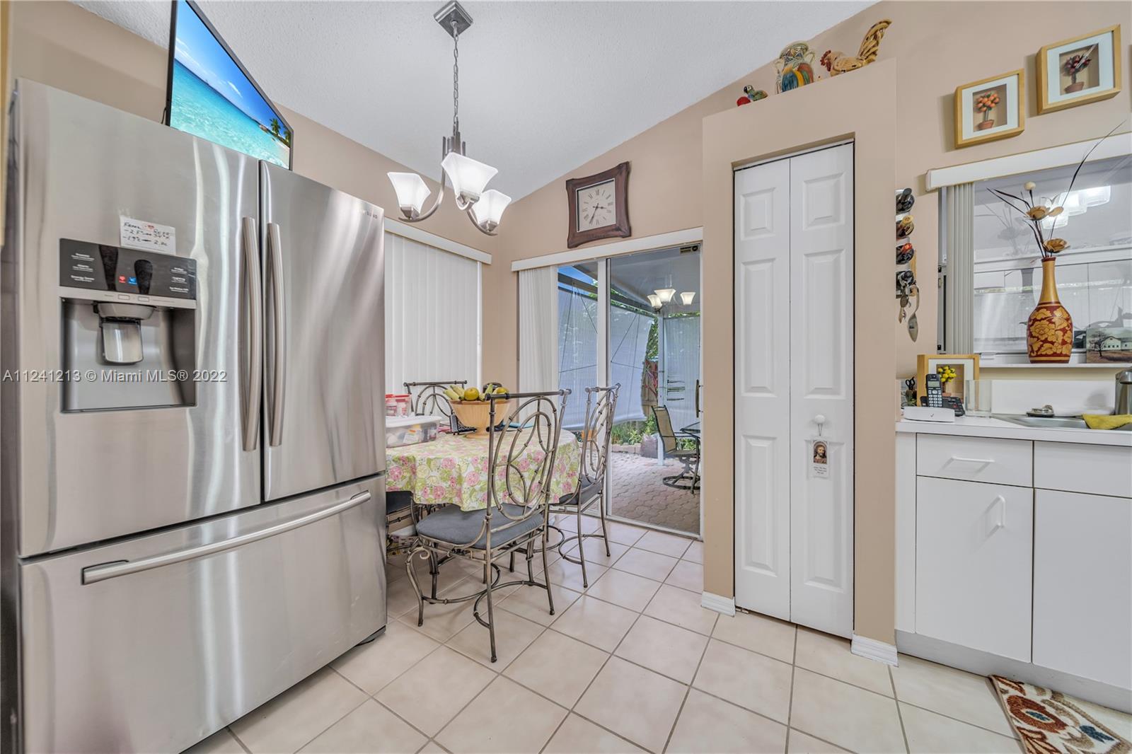 14202 Southwest 151st Court Miami, FL 33196 - Photo 8 of 23 a kitchen with stainless steel appliances a refrigerator and microwave