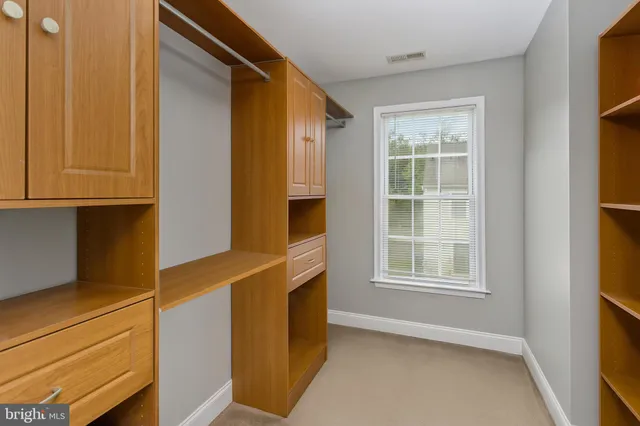 a view of an empty room with windows