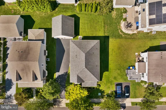 an aerial view of a house with outdoor space