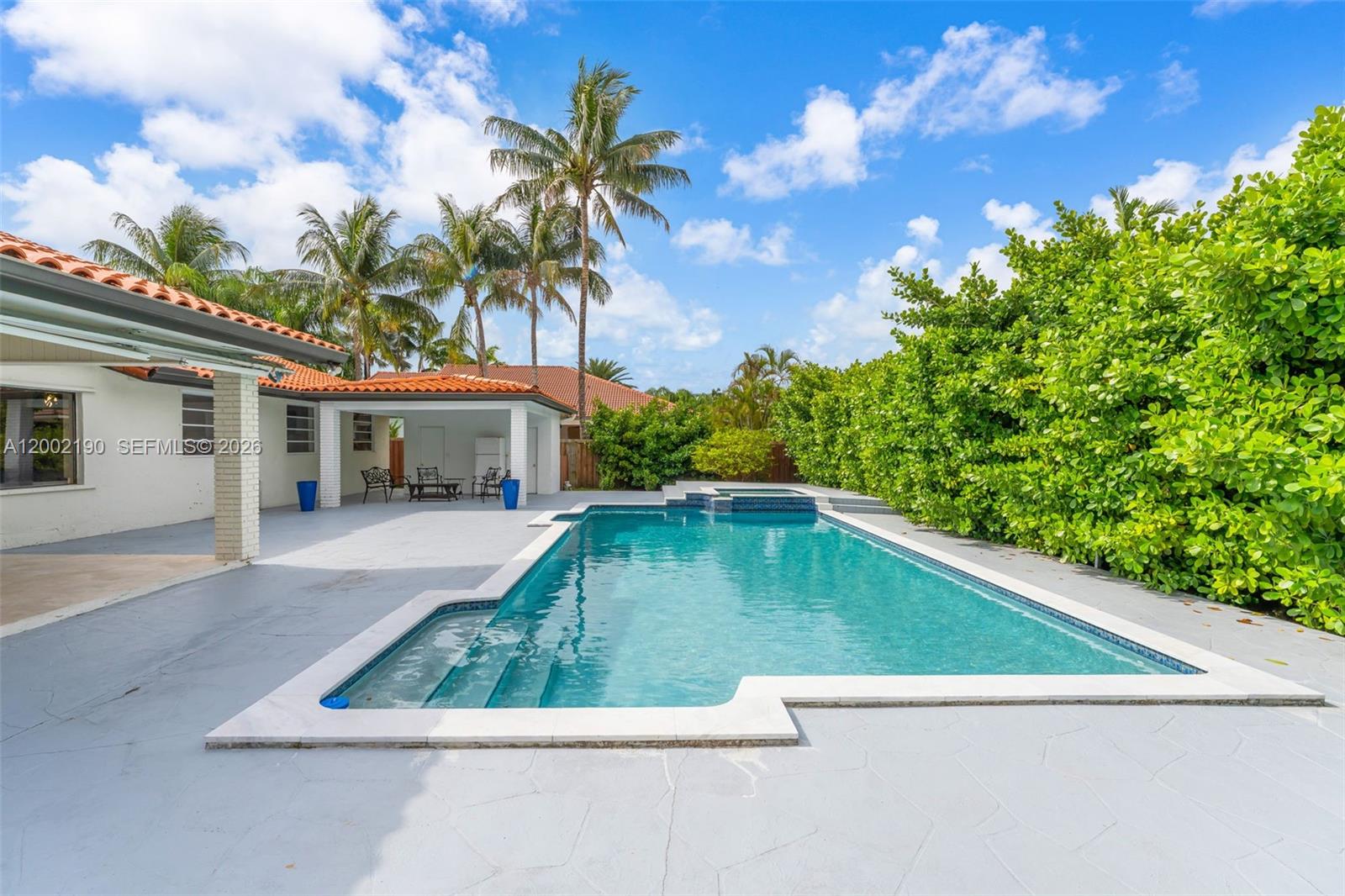 a view of swimming pool with a yard