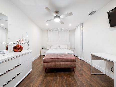 11350 Southwest 30th Street Miami, FL 33165 - Photo 15 of 25 a bedroom with a bed and a white cabinets