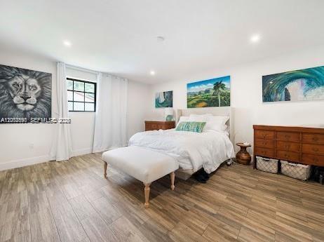 11350 Southwest 30th Street Miami, FL 33165 - Photo 16 of 25 a bedroom with a bed and wooden floor