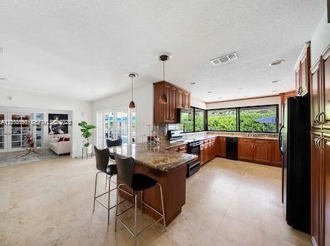 11350 Southwest 30th Street Miami, FL 33165 - Photo 18 of 25 a living room with furniture and a large window