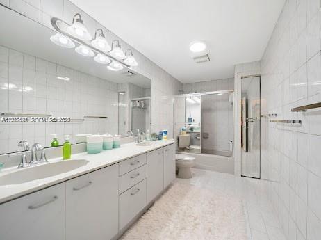 11350 Southwest 30th Street Miami, FL 33165 - Photo 19 of 25 a large white bathroom with a granite countertop sink mirror and a shower
