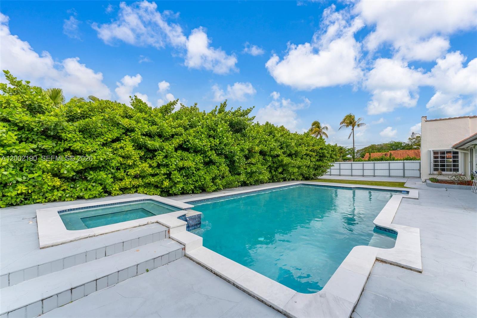 11350 Southwest 30th Street Miami, FL 33165 - Photo 3 of 25 a view of a swimming pool with a patio
