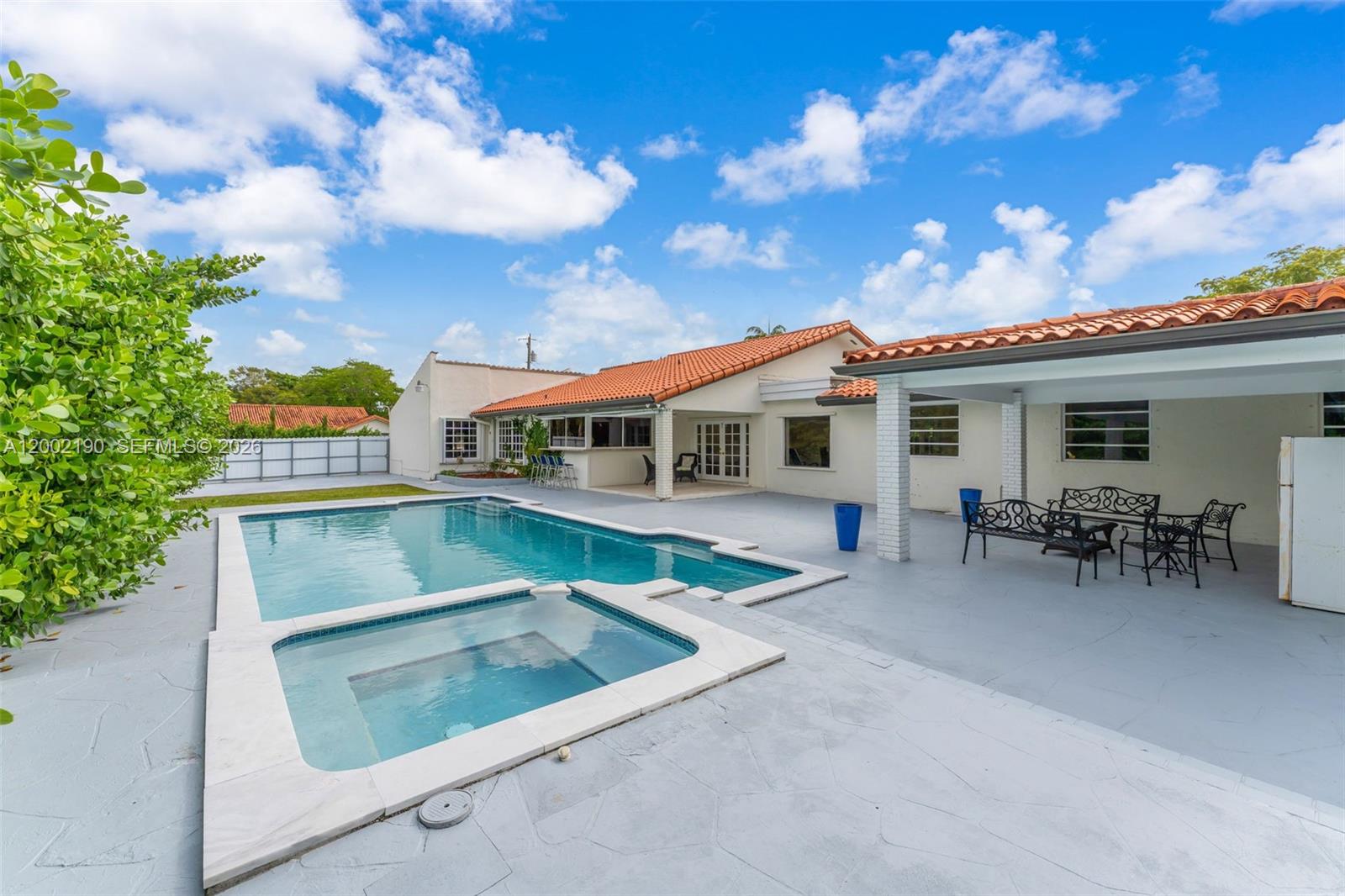 11350 Southwest 30th Street Miami, FL 33165 - Photo 4 of 25 a view of house with swimming pool and sitting area
