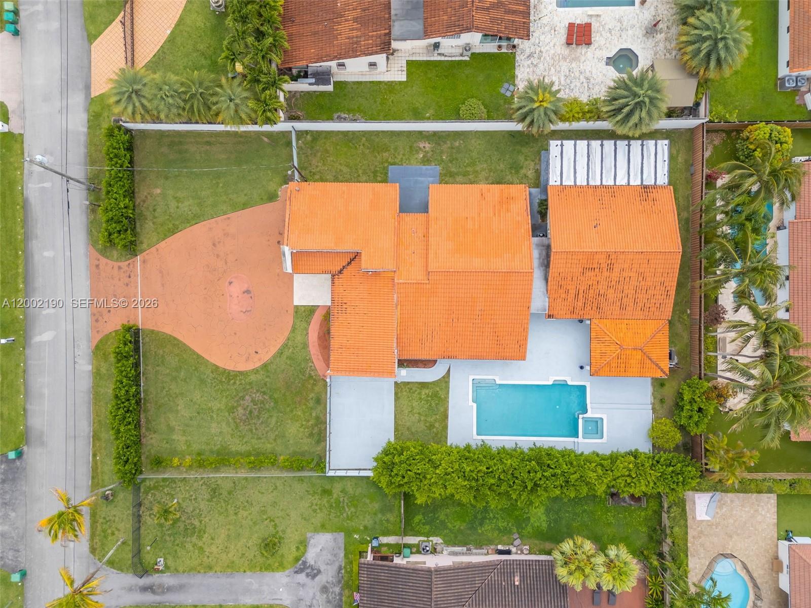 11350 Southwest 30th Street Miami, FL 33165 - Photo 6 of 25 an aerial view of a house with a garden and swimming pool