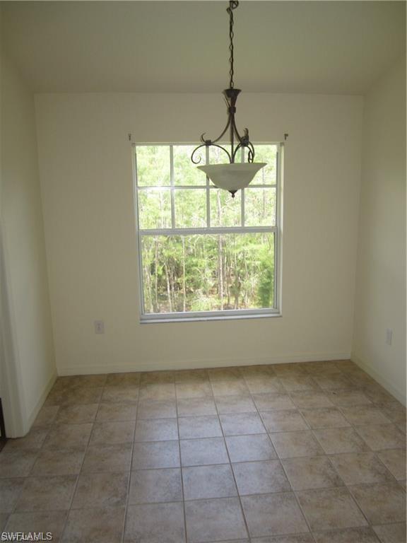7960 Preserve Circle, Unit 634 Naples, FL 34119 - Photo 5 of 12 a view of an empty room with a window