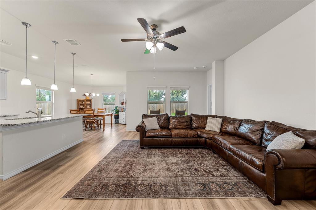 10712 Peperak Court Waco, TX 76708 - Photo 5 of 25 a living room with furniture ceiling fan and a rug