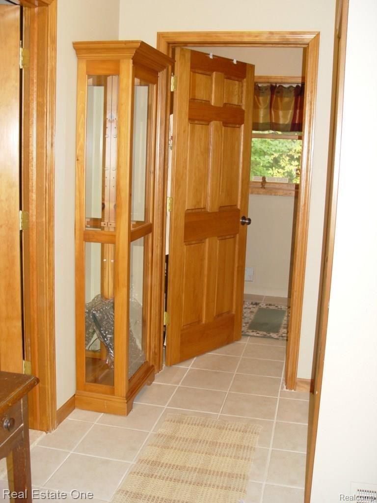 6240 North Latson Road Howell, MI 48855 - Photo 14 of 34 HALL TO LAUNDRY AND HALF BATH