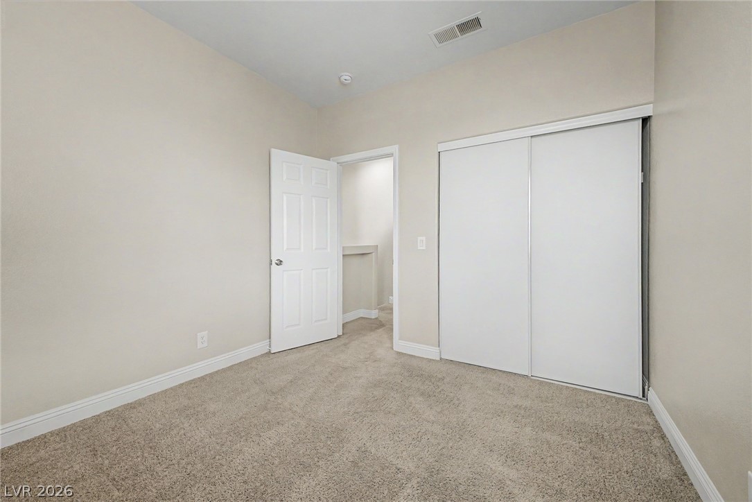 2316 Ramsgate Drive Henderson, NV 89074 - Photo 16 of 28 A well-lit room awaits your personal touch with soft carpeting and functional closet space.