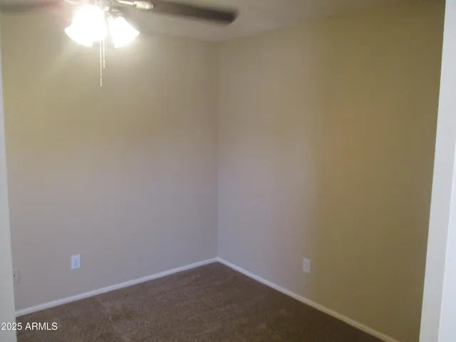 a bathroom with a shower and a mirror