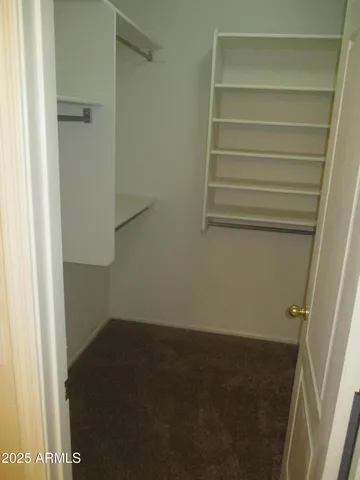 a view of small space with racks on the wall