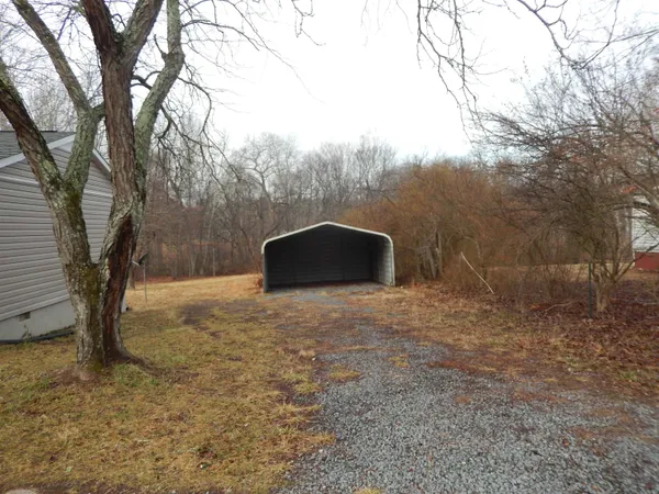 a backyard of a house with lots of green space