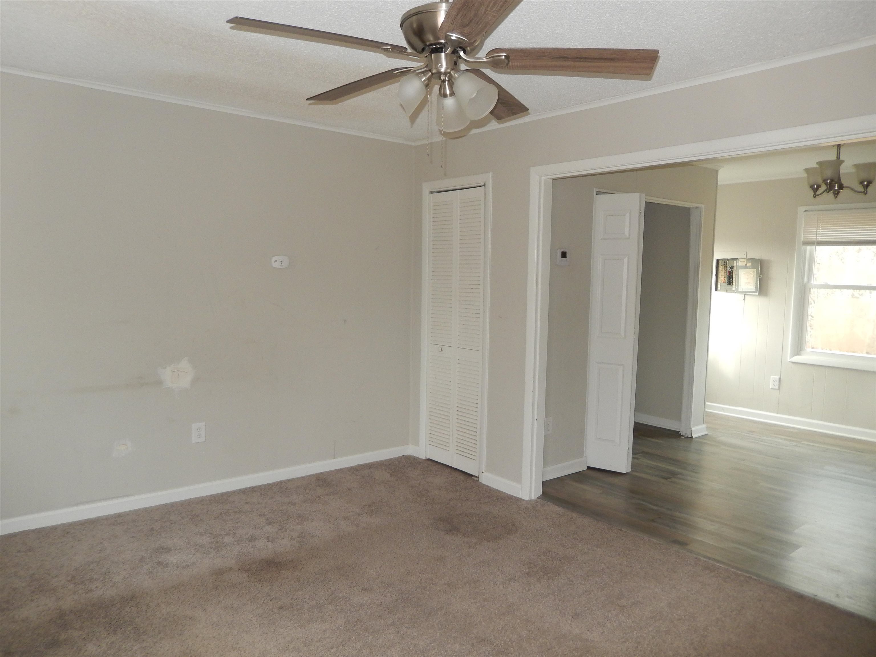 114 Marshall Road Madison, VA 22727 - Photo 5 of 16 wooden floor in an empty room with a window