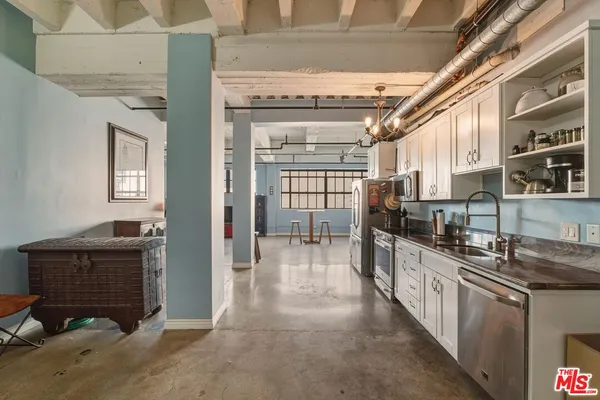 a kitchen with granite countertop lots of counter top space