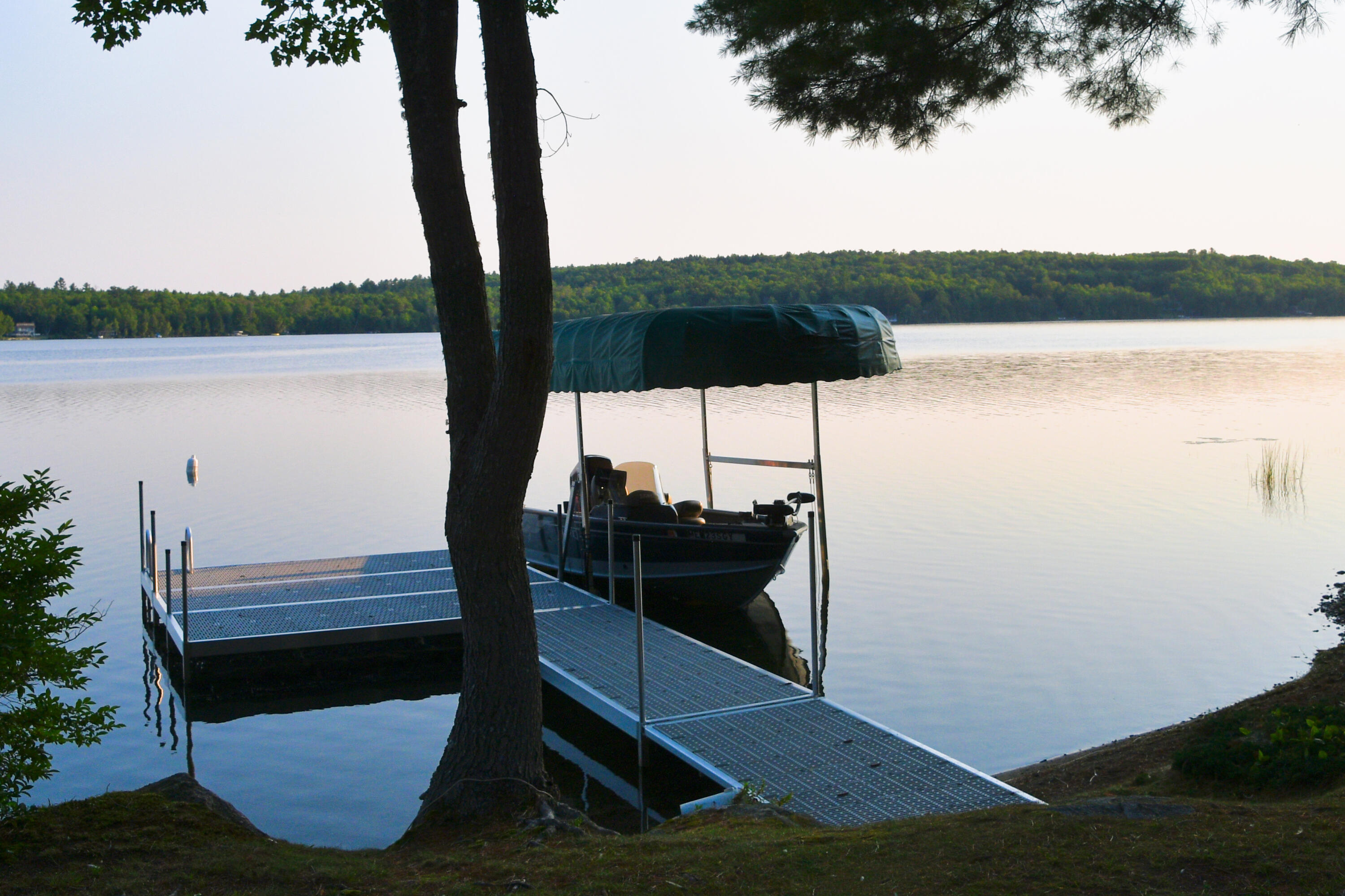 308 Stanhope Mill Road Lincoln, ME 04457 - Photo 36 of 43 Nikon shot of the dock and lake edited