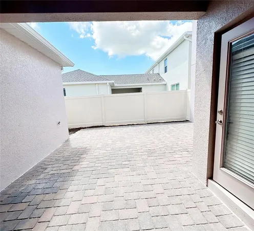 a view of empty room with windows