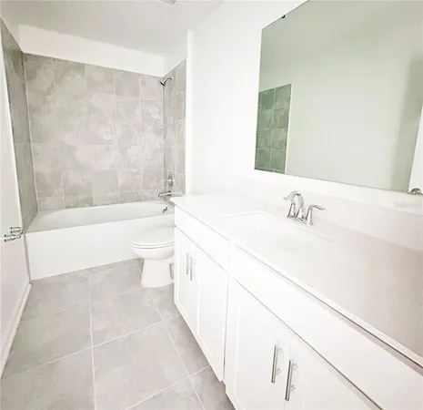 a bathroom with a sink a toilet and bathtub