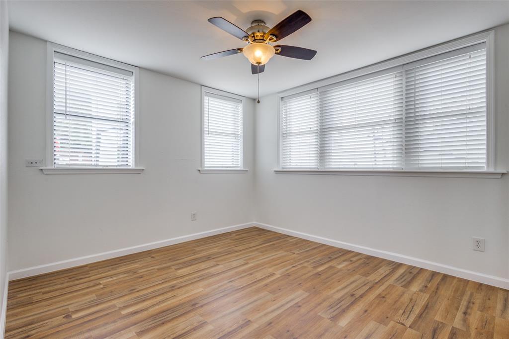 2309 Wesley Street, Unit B Greenville, TX 75401 - Photo 12 of 27 a view of empty room with wooden floor and fan