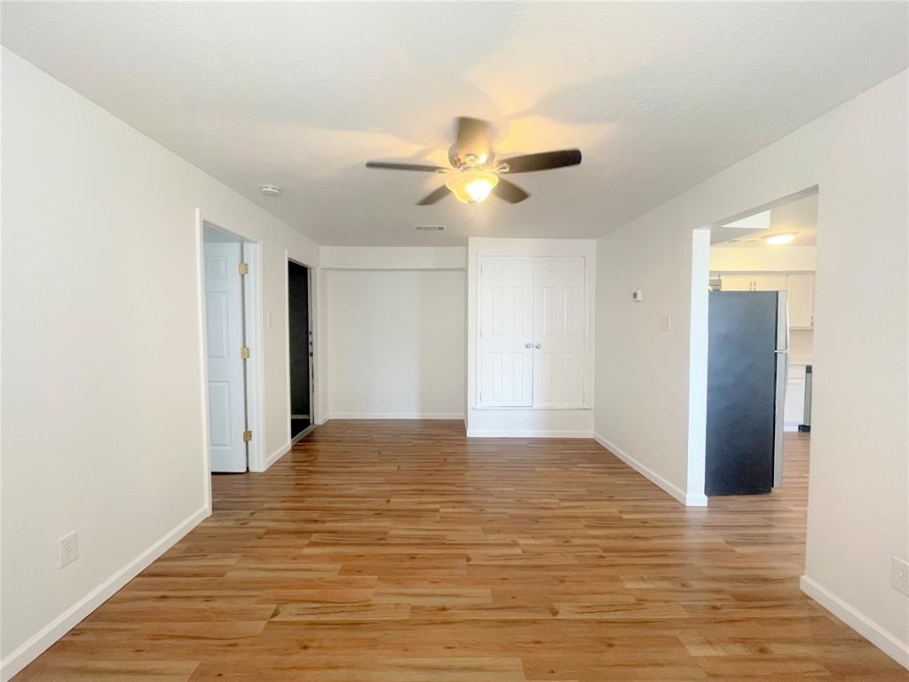 2309 Wesley Street, Unit B Greenville, TX 75401 - Photo 8 of 27 a view of empty room with wooden floor